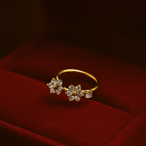 Elegant floral gold nose ring with sparkling white stones by H&A Jewellery, displayed on a red velvet box.