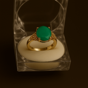 Elegant gold ring with oval feroza green gemstone and textured detailing in clear acrylic box by H&A Jeweller