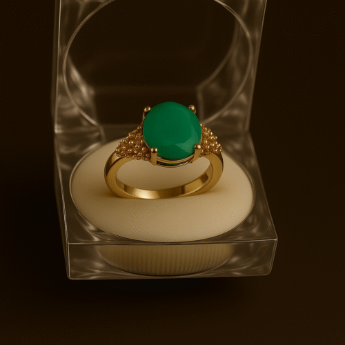 Elegant gold ring with oval feroza green gemstone and textured detailing in clear acrylic box by H&A Jeweller