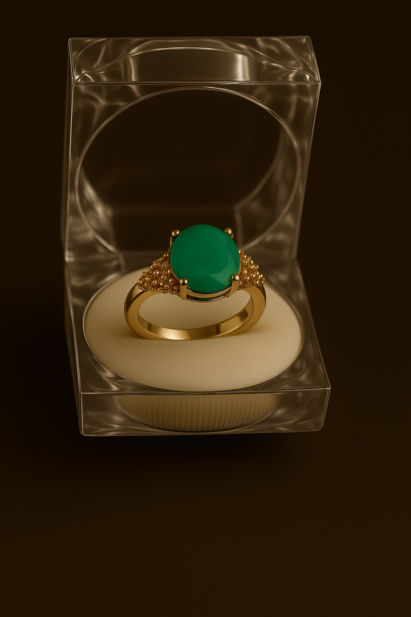 Elegant gold ring with oval feroza green gemstone and textured detailing in clear acrylic box by H&A Jeweller