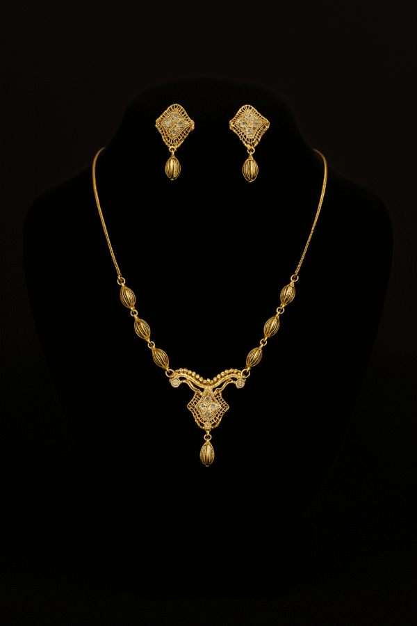 One carat gold jewelry set by H&A featuring intricate necklace and matching earrings on black background