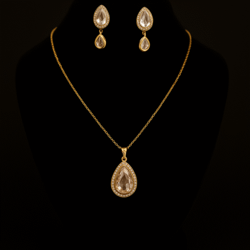Golden teardrop jewelry set with crystal stone pendant and matching drop earrings by H&A Jeweller