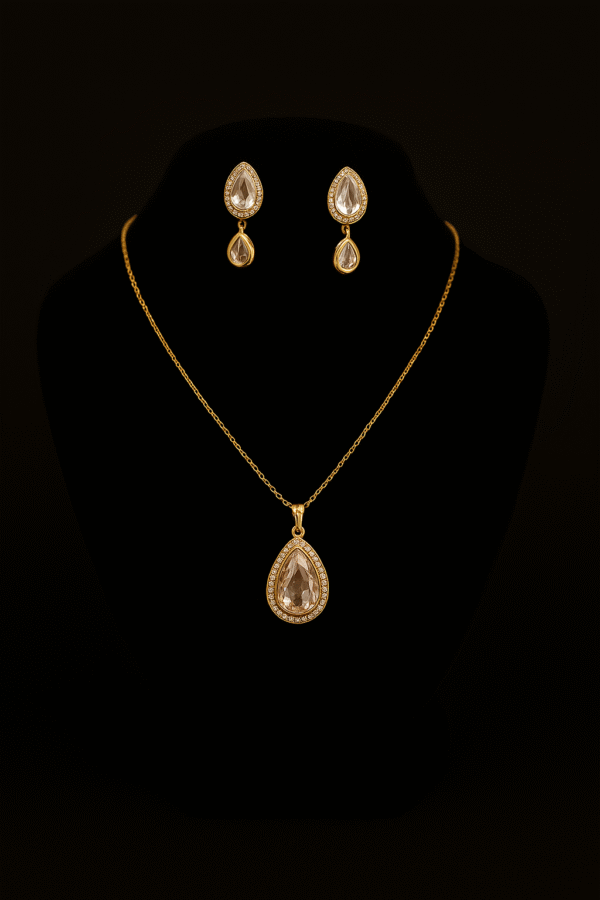 Golden teardrop jewelry set with crystal stone pendant and matching drop earrings by H&A Jeweller