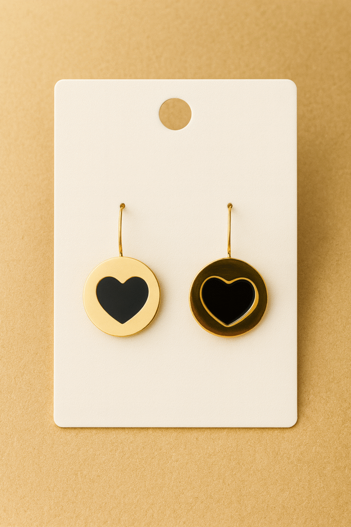 Gold circular drop earrings with black heart design – H&A Jewellery