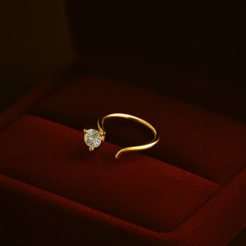 Elegant gold nose ring with a single sparkling solitaire stone by H&A Jewellery, displayed on a red velvet box.